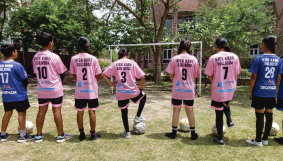 Girls playing football
